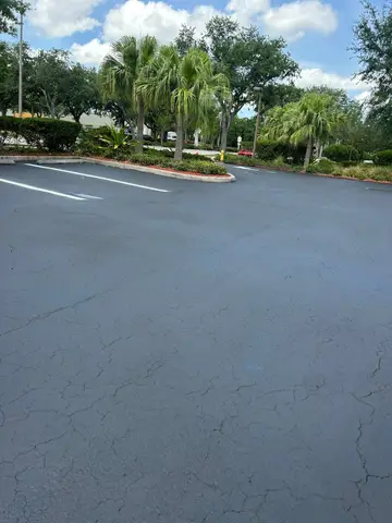 Freshly sealed parking area with clear lines and markings