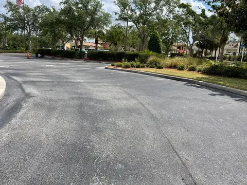 Smooth asphalt surface in a commercial area with no cracks