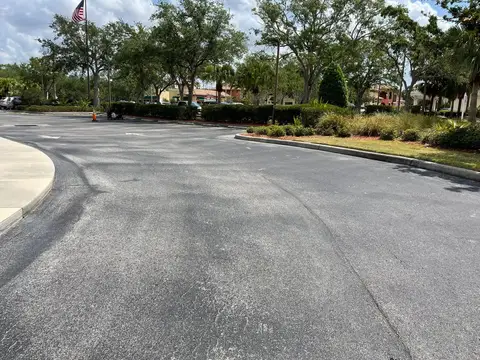 Smooth asphalt road with clear markings in a commercial area