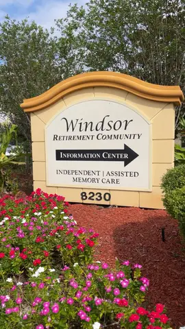 Sign for Windsor Retirement Community surrounded by flowers