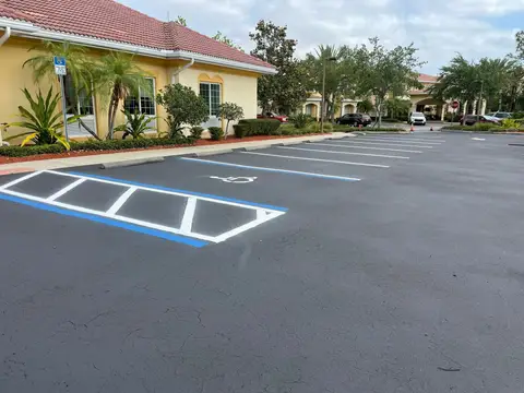 Freshly painted parking lot with designated spaces in Cape Coral