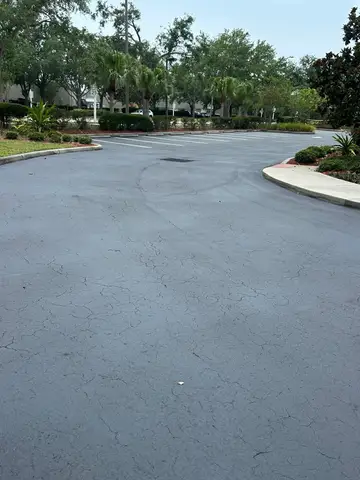 Newly sealed asphalt road with clear lane markings in Cape Coral